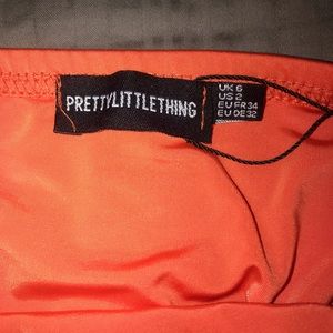 shape orange slinky lace up back bodycon dress